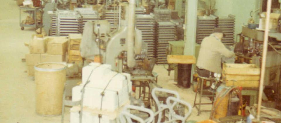 Archival photo: factory floor with presses and assembly stations