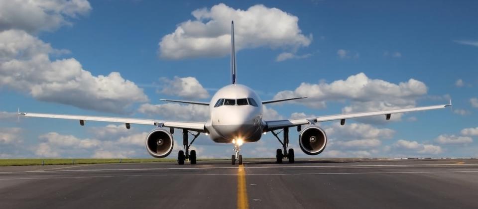 Passenger jet in flight — aerospace market